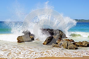 Big wave crashes on to the shore.