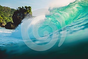 Big wave in ocean. Breaking turquoise wave in Bali