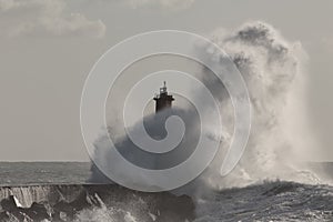 Big wave splash over beacon