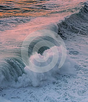 Big wave at sunset