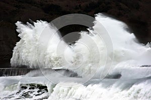 Big waves breaking on breakwater