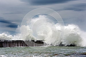 Big waves breaking on breakwater