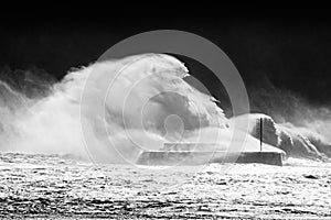 Big waves breaking on breakwater