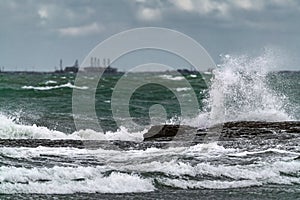 Big waves breaking coastal rocks