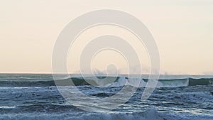 Big Waves Breaking Ocean Seascape Background with Copy Space in Orange Sunset Light, Sea Crashing Be