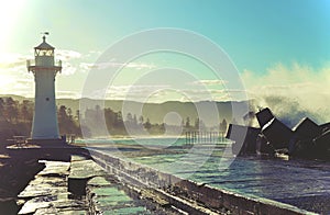 Big waves breaking over Wollongong lighthouse and break wall