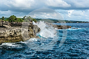 Big waves breaking and splashing on the rocks