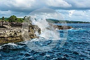 Big waves breaking and splashing on the rocks