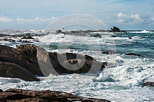 Big waves broken near stone seashore of France