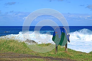 Big waves clashing on Pacific ocean coastline, Hanga Roa town, Easter island, Chile