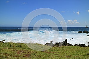 Big waves clashing on Pacific ocean, the town of Hanga Roa, Easter island, Chile, South America