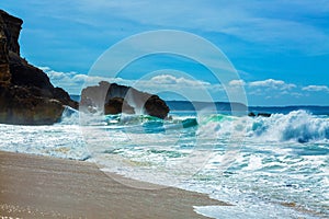 Big waves crash into the rocks of North beach in Nazare city, Portugal