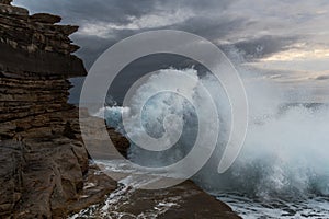 Big waves crashing against cliffs