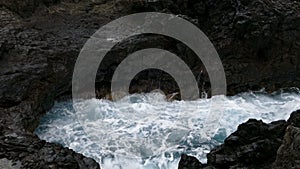 Big waves crashing on cliff of lava rocks.Time Lapse.