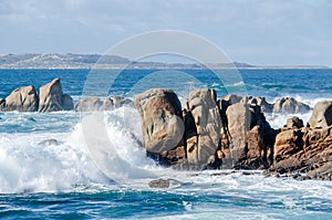 Big waves crashing on rocks coastline