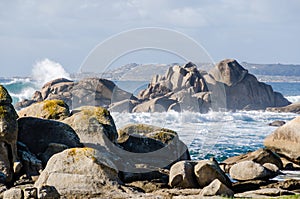 Big waves crashing on rocks coastline