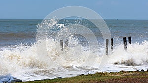 Big waves crushing on shore of a tropical beach island during storm. Stormy sea weather. Power in nature background. Taken before