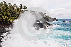 Big waves crushing on the shore of a tropical island photo