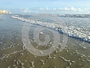 Big Waves with Foam Rolling on Daytona Beach at Daytona Beach Shores, Florida.