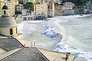 Big waves hit the beach of Camogli, Italy