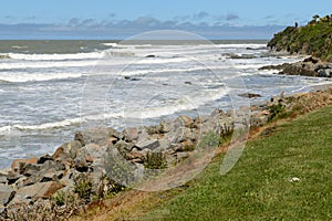 Big waves and huge boulders on the Pacific Ocean coast near the Kaka Point