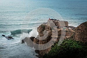 Big Waves of Nazare at Fort of Sao Miguel Arcanjo Lightouse - Nazare, Portugal photo