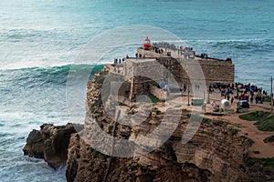 Big Waves of Nazare at Fort of Sao Miguel Arcanjo Lightouse - Nazare, Portugal photo