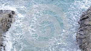 Big waves pounded on the rocks