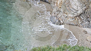 Big waves pounded on the rocks