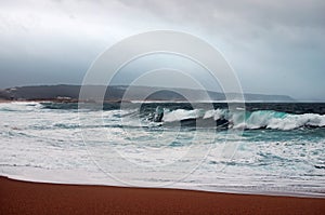 Big waves roll ashore. Atlantic ocean. (Nazare, Portugal)