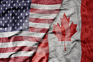 big waving colorful flag of united states of america and national flag of canada on the dollar money background. finance concept