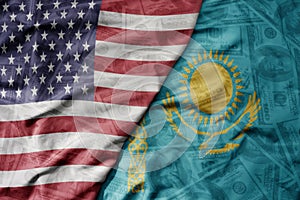 big waving colorful flag of united states of america and national flag of kazakhstan on the dollar money background. finance