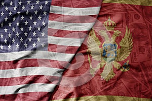 big waving colorful flag of united states of america and national flag of montenegro on the dollar money background. finance