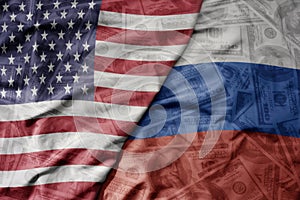 big waving colorful flag of united states of america and national flag of russia on the dollar money background. finance concept