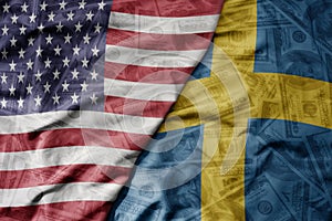 big waving colorful flag of united states of america and national flag of sweden on the dollar money background. finance concept