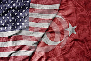 big waving colorful flag of united states of america and national flag of turkey on the dollar money background. finance concept