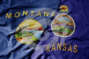big waving colorful national flag of kansas state and flag of montana state