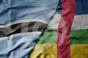 big waving national colorful flag of botswana and national flag of central african republic