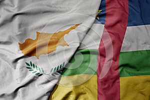 big waving national colorful flag of central african republic and national flag of cyprus