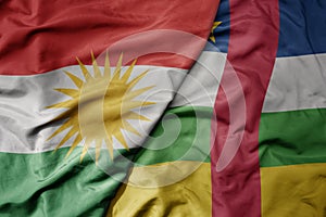big waving national colorful flag of central african republic and national flag of kurdistan