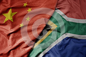 big waving national colorful flag of china and national flag of south africa