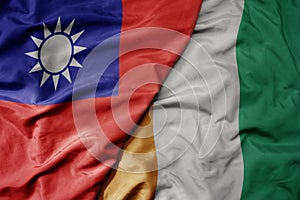 big waving national colorful flag of taiwan and national flag of cote divoire