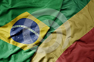big waving realistic national colorful flag of brazil and national flag of republic of the congo photo