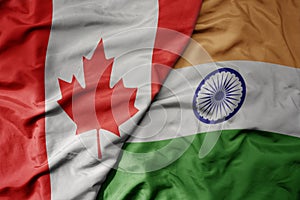 big waving realistic national colorful flag of canada and national flag of india