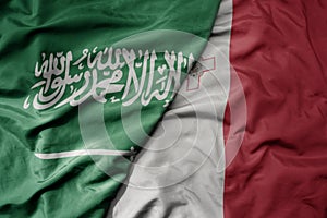 big waving realistic national colorful flag of saudi arabia and national flag of malta