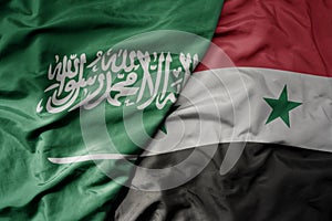 big waving realistic national colorful flag of saudi arabia and national flag of syria