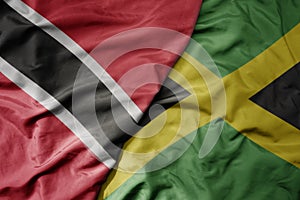 big waving realistic national colorful flag of trinidad and tobago and national flag of jamaica