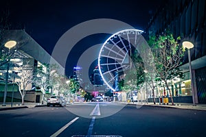 Big wheel in lights on dark street