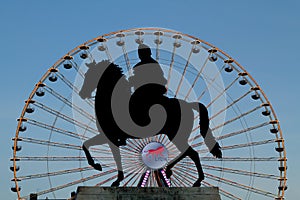 Big wheel and statue in Lyon, Place Bellecour