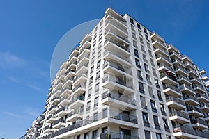 Big white apartment building with balconies